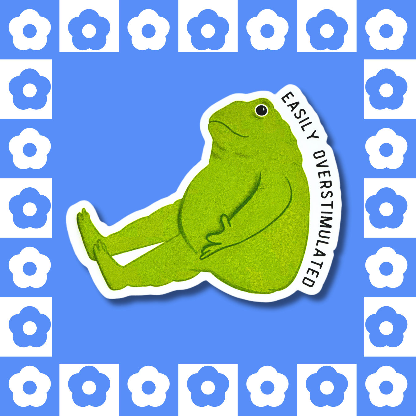 Matte vinyl sticker featuring a green frog with the text 'EASILY OVERSTIMULATED' in bold black letters