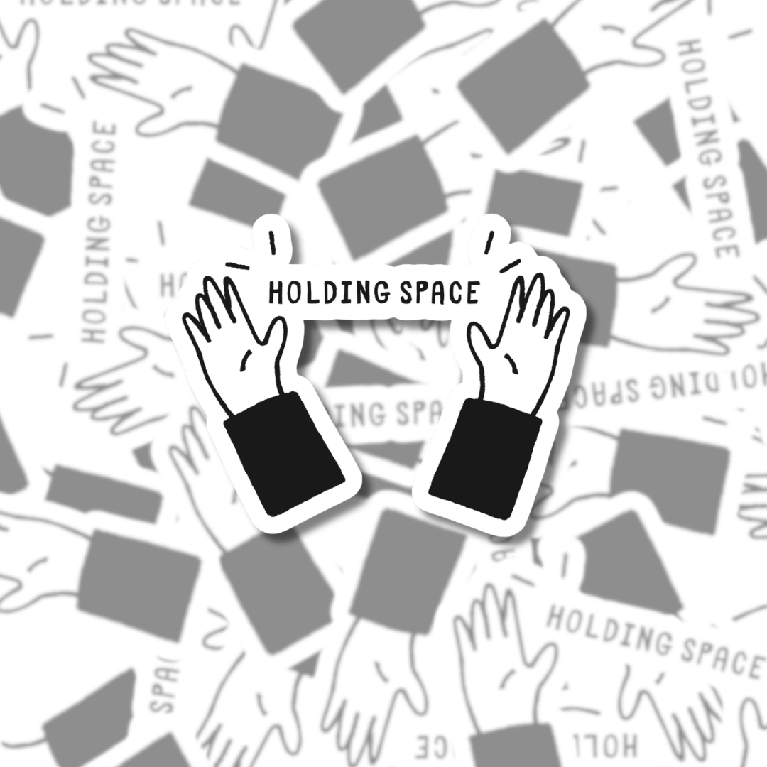 Matte vinyl sticker featuring two hands holding a banner that reads ‘HOLDING SPACE’